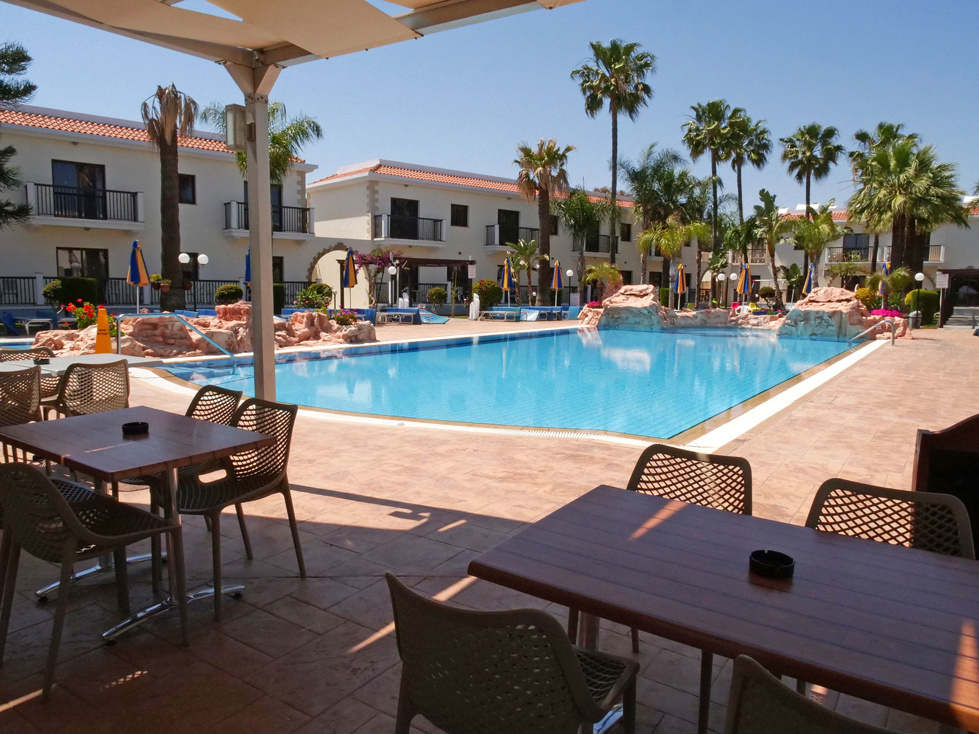 Loutsiana Hotel pool bar sitting area in front of the pool