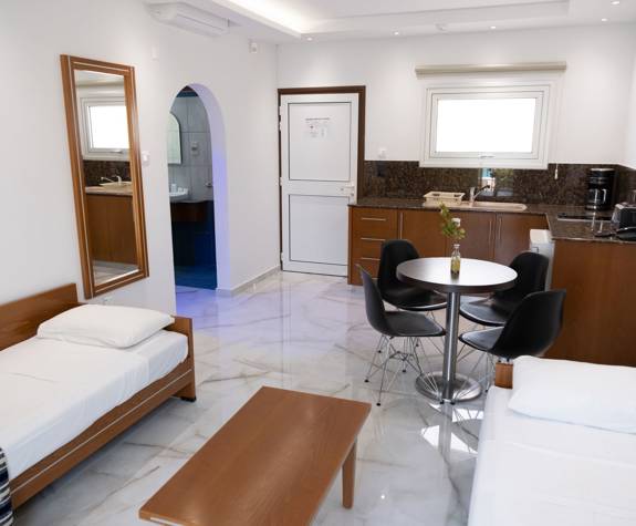 Loutsiana Hotel Deluxe One Bedroom Apt living room and kitchen
