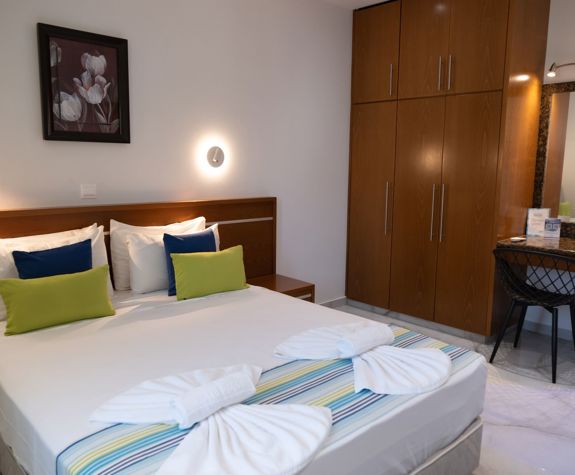 Loutsiana Hotel Deluxe One Bedroom Apt double bed and closet
